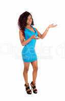 Black woman standing blue dress.