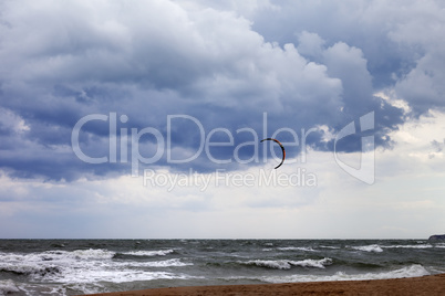 Power kite in sea and cloudy sky