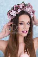 Pretty young woman with flowers in her hair