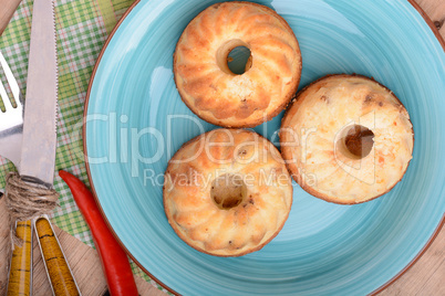 cheese cake on blue plate with red pepper