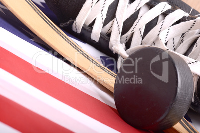 Puck, skates and hockey stick of the American flag
