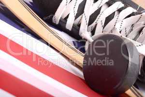 Puck, skates and hockey stick of the American flag