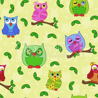 Seamless pattern with ornamental owls over yellow