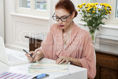 Young Businesswoman Looking at Computer Seriously