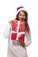 Pretty woman in a Santa hat with a large gift