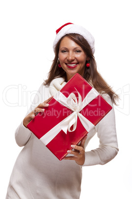 Pretty woman in a Santa hat with a large gift