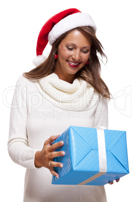 Beautiful vivacious woman with a Christmas gift