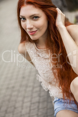 Pretty Blond Woman Sitting on Red Chair