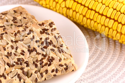 sweet cake on white plate and corn