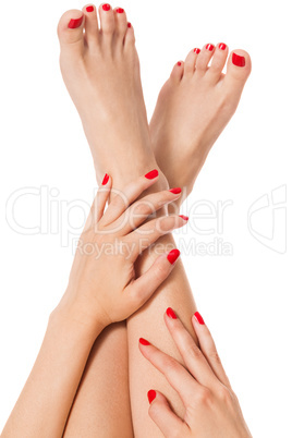 Woman with beautiful red finger and toenails