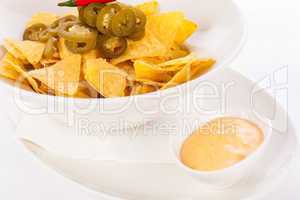 Nachos with cheese sauce and chilli pepperoni