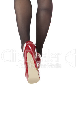 Woman Legs Wearing Red Shoes and Gray Stockings