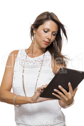 Woman chatting on a mobile while reading a tablet