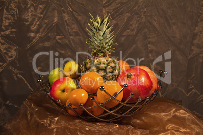 Fruit / Still life of fruit: apples, pineapple, tangerines, pomegranates.