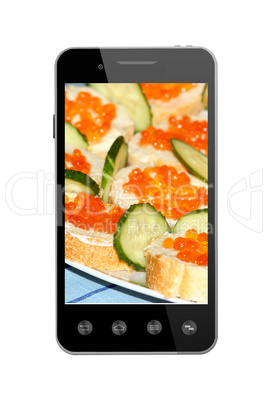 smart-phone with sandwiches  with red caviar isolated
