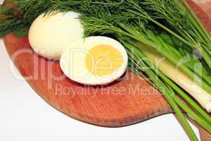 sliced boiled egg, green onions and dill