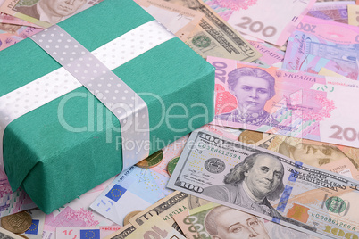 american and european money background and green gift box