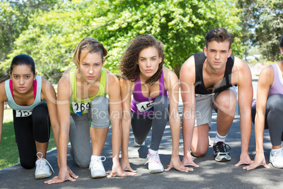 Fit people running race in park