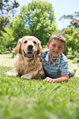 Little boy with his dog in the park