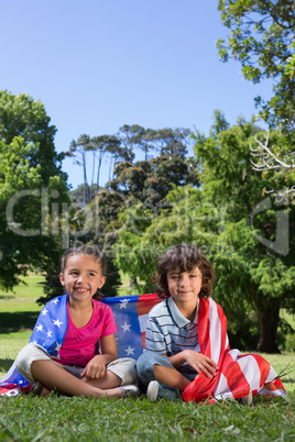 Little siblings with american flag