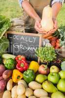 Farmer showing his organic squash