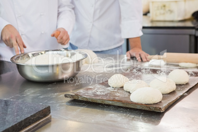 Colleagues working together on worktop