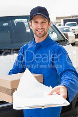 Delivery man showing clipboard to sign to customer