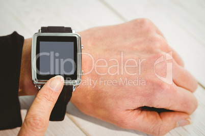 Businesswoman using a smart watch