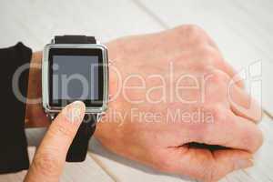 Businesswoman using a smart watch