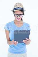 Smiling woman using her tablet