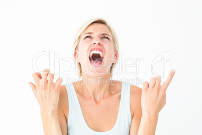 Upset woman screaming with hands up