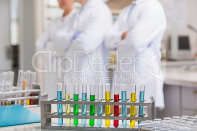 Scientists posing with arms crossed