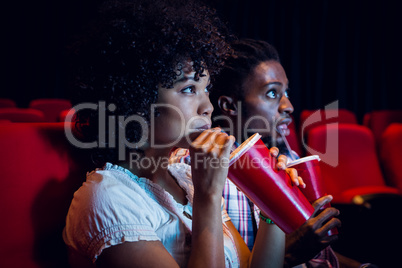 Young couple watching a film