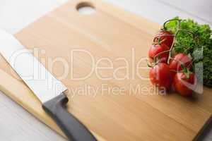 Chopping board tomatoes and parsley