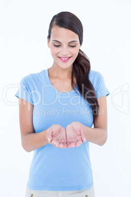 Smiling brunette looking her hands