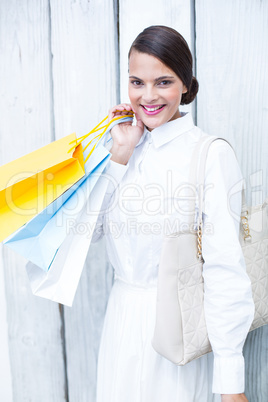 Beautiful brunette holding shopping bags