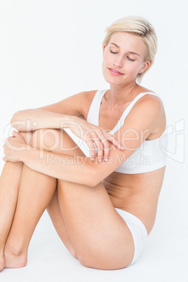 Peaceful woman sitting on the floor