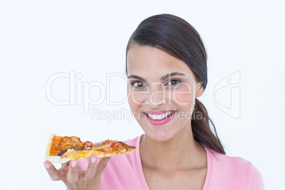 Beautiful woman eating a pizza