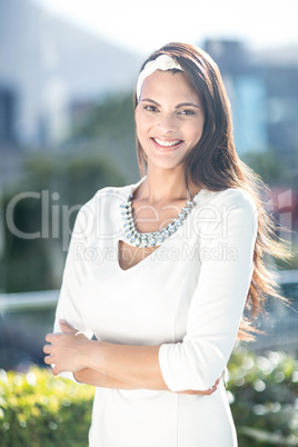 Gorgeous woman smiling at camera with arms crossed