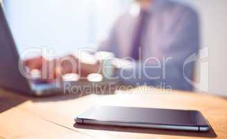 Businessman using laptop at desk