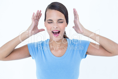 Stressed woman raising her hands around her head