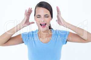 Stressed woman raising her hands around her head