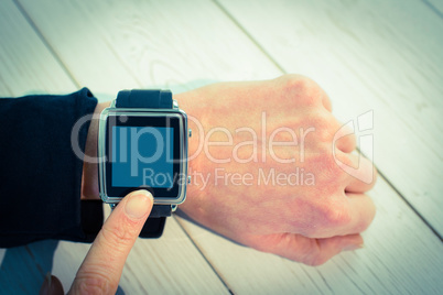 Businesswoman using a smart watch