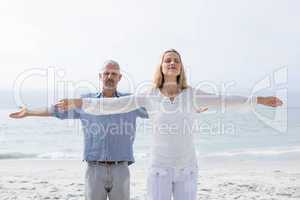 Happy couple doing yoga together