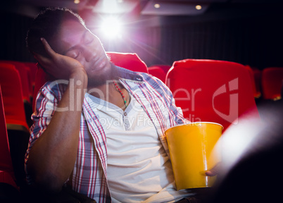 Young man sleeping in chair