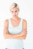 Upset blonde looking at camera with arms crossed