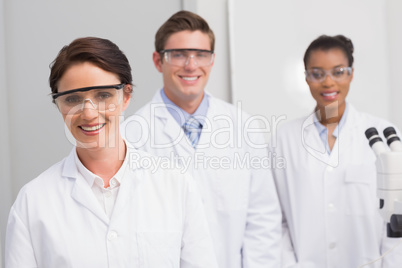 Scientists smiling and looking at camera