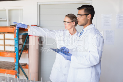 Scientist showing something to her colleague