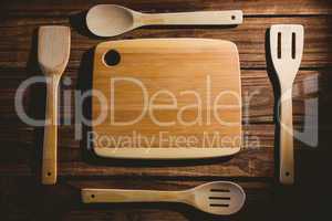 Chopping board with wooden utensils