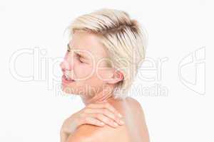 Suffering woman touching her shoulder